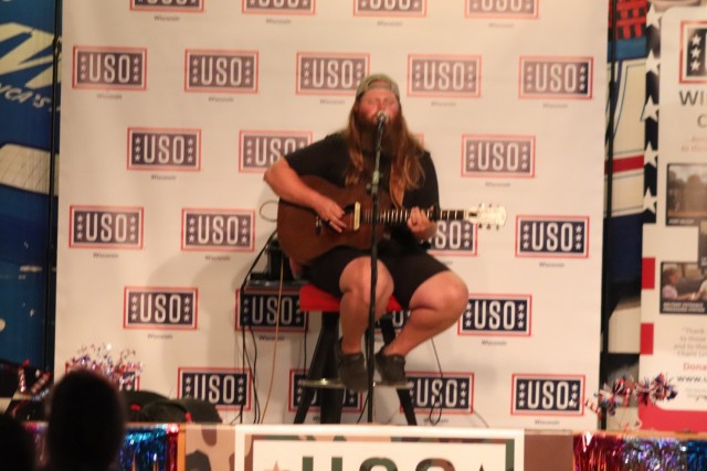 Entertainer and musician Chris Kroeze sings a song June 15, 2021, during his 90-minute concert at Fort McCoy, Wis. He entertained dozens of audience members in McCoy's Community Center during a concert that was organized by Wisconsin USO and...