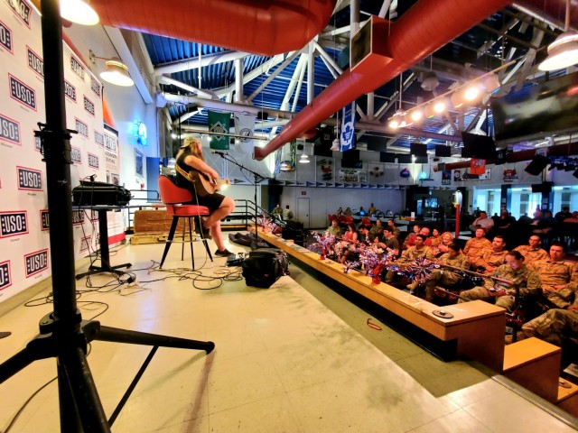 Artist Chris Kroeze sings a song June 15, 2021, during his 90-minute concert at Fort McCoy, Wis. He entertained dozens of audience members in McCoy's Community Center during a concert that was organized by Wisconsin USO and supported by the Fort...