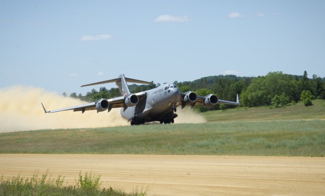 An Air Force C-17 Globemaster III takes off from the Young Air Assault Strip on South Post on June 16, 2021, during the National Guard Patriot '21 exercise at Fort McCoy, Wis. Multiple Air Force and civilian agencies participated in the exercise...