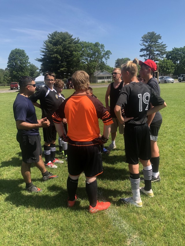 Sgt. 1st Class Francisco Marquezpalmas, the equal opportunity advisor for the 181st Multifunctional Training Brigade, discusses the strategy for the second half of a soccer game June 5, 2021, in Tomah, Wis. Marquezpalmas has been a coach for the...
