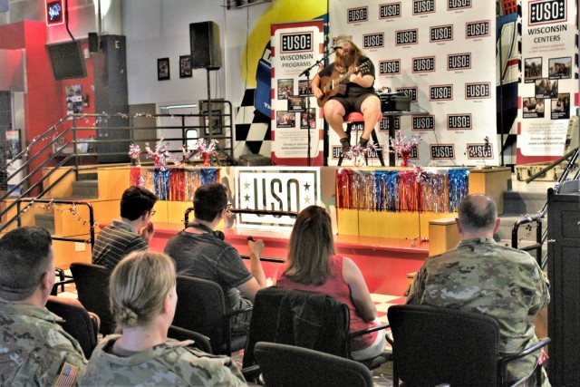 Artist Chris Kroeze sings a song June 15, 2021, during his 90-minute concert at Fort McCoy, Wis. He entertained dozens of audience members in McCoy's Community Center during a concert that was organized by Wisconsin USO and supported by the Fort...