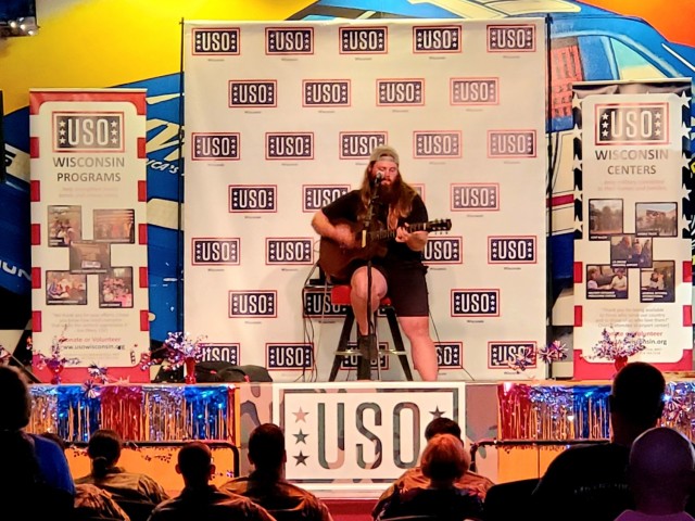 Artist Chris Kroeze sings a song June 15, 2021, during his 90-minute concert at Fort McCoy, Wis. He entertained dozens of audience members in McCoy's Community Center during a concert that was organized by Wisconsin USO and supported by the Fort...