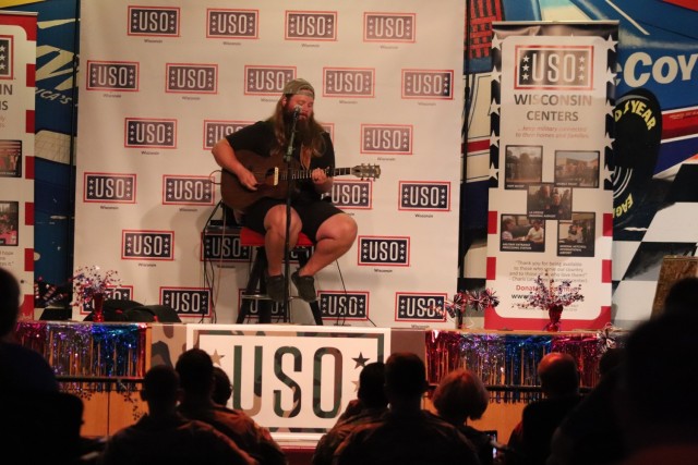 Entertainer and musician Chris Kroeze sings a song June 15, 2021, during his 90-minute concert at Fort McCoy, Wis. He entertained dozens of audience members in McCoy's Community Center during a concert that was organized by Wisconsin USO and...