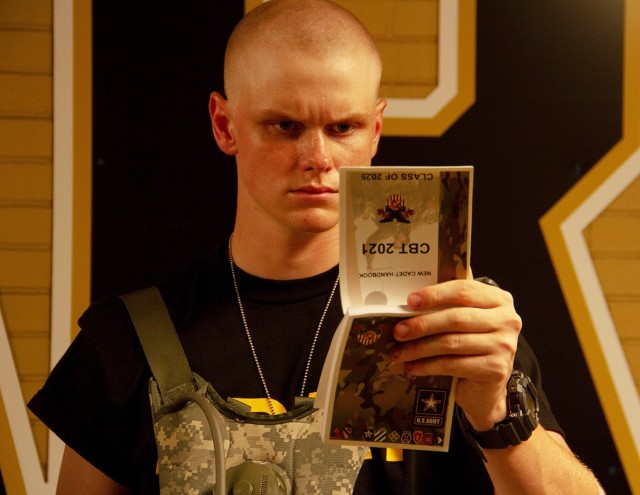 A new cadet reads the New Cadet Handbook during Reception Day at West Point Monday. During the six weeks of Cadet Basic Training, new cadets will be physically and mentally tested as they learn basic combat and leadership skills ahead of the...