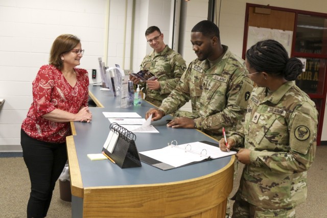 Connie Schauer, left, education services specialist, 88th Readiness Division, speaks with Staff Sergeants Weston Abshire, 230th Sustainment Brigade, Bryntin Butler, Alpha Company, 949th Brigade Support Battalion, and Brandi Jackson, 518th...