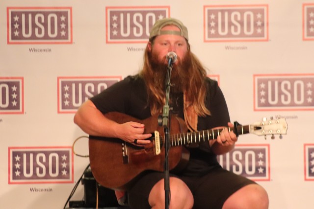 Artist Chris Kroeze sings a song June 15, 2021, during his 90-minute concert at Fort McCoy, Wis. He entertained dozens of audience members in McCoy's Community Center during a concert that was organized by Wisconsin USO and supported by the Fort...