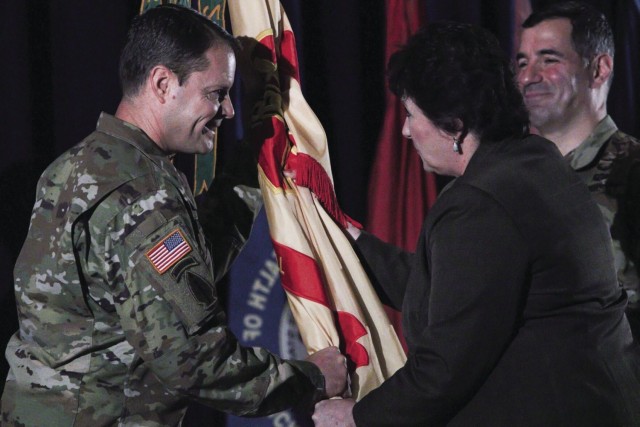 Colonel Andrew Q. Jordan, incoming Fort Campbell garrison commander, accepts the garrison’s guidon from Brenda Lee McCullough, director, U.S. Army Installation Management Command Directorate-Readiness, June 28 during a change of command ceremony...