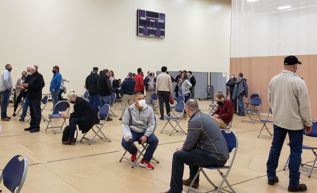 St. Paul District employees wait 15 minutes after receiving their vaccine to monitor for an adverse reaction at the Minneapolis Air Force Reserve April 27.