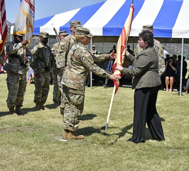 Change of Command Ceremony between outgoing garrison commander Col. Charles R. Bell Jr. and incoming commander Col. Lisa M. Lamb, Fort Hunter Liggett, California June 30, 2021. Brenda Lee McCullough, IMCOM-Readiness director, passed the garrison colors to the new garrison commander, Col. Lisa M. Lamb.