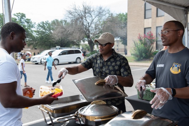 Brig. Gen. Ronald R. Ragin, Commanding General, 13th Expeditionary Sustainment Command serves food July 2.  During Soldier Appreciation Day, leaders prepared and served food for Soldiers in attendance. (U.S. Army photo by Sgt. 1st Class Kelvin Ringold)