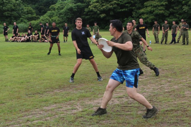 A member of the Japan Ground Self-Defense Force looks for a teammate to throw to during an ultimate Frisbee tournament with Soldiers assigned to 1st Battalion, 28th Infantry Regiment, 3rd Infantry Division, and JGSDF members on Aibano Training...