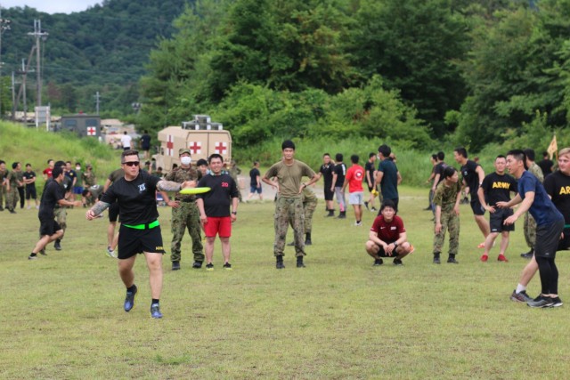 U.S. Army 1st Sgt. William Perry, assigned to 1st Battalion, 28th Infantry Regiment, 3rd Infantry Division, throws a Frisbee while playing in an ultimate Frisbee match against members of the Japan Ground Self-Defense Force on Aibano Training Area,...
