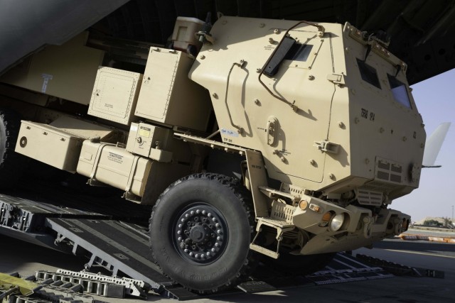 A High Mobility Artillery Rocket System (HIMARS) is being loaded into a C-17 aircraft on Ali Al Salem Air Base, Kuwait, December 22, 2020. This mission shows the interoperability between the Army and Air Force as they display their capabilities to load and unload heavy cargo and weapons systems. (U.S. Army Reserve photo by Sgt. Vontrae Hampton)