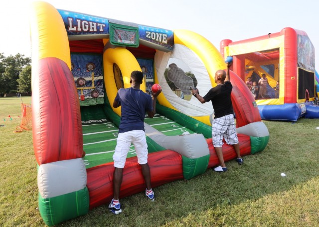 Father and son play games at Fort Knox July 4 Celebration