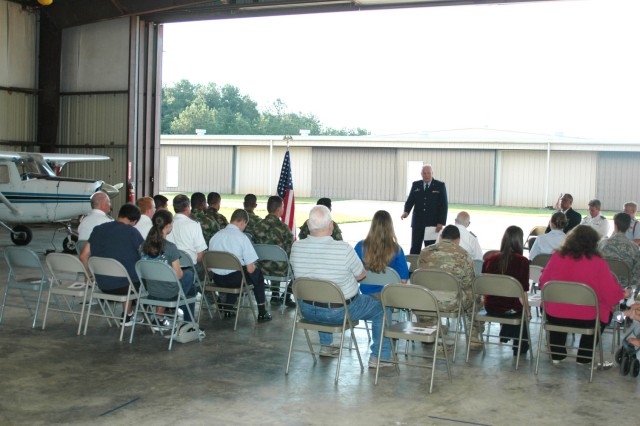 Retired Air Force Lt. Col. C. Ronald Kariker, addresses the audience at the Civil Air Patrol change of command June 22 before the ceremony begins.