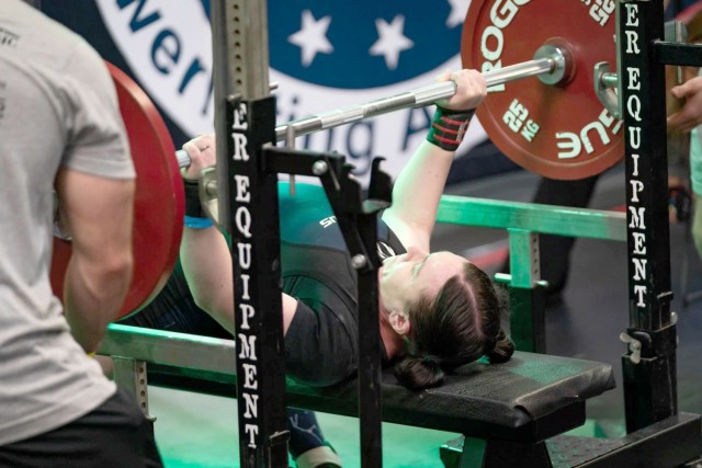 Capt. Erin Harding, 1st Battalion, 5th Aviation Regiment, competes in the bench press event at the 2021 United States Powerlifting Association meet in San Antonio, Texas.