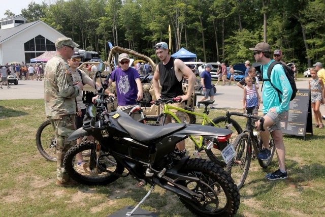 Cyclists are introduced to an Army Zero FX Z-Force 5.7 Electric Motorcycle during the Fourth of July NASCAR Cup Series race at Road America, Elkhart Lake, Wisconsin, July 4, 2021. The U.S. Army recruiting battalion, along with the Appleton Recruiting Company brought recruiters and displays from across their area to meet with citizens, allow them to experience Army technology and evaluate opportunities in military service. Brig. Gen. Ernest Litynski, Commanding General, 85th U.S. Army Reserve Support Command, attended the race as the Army’s senior leader and swore in 20 future Soldiers at the pre-race ceremonies.
(U.S. Army Reserve photo by Anthony L. Taylor)