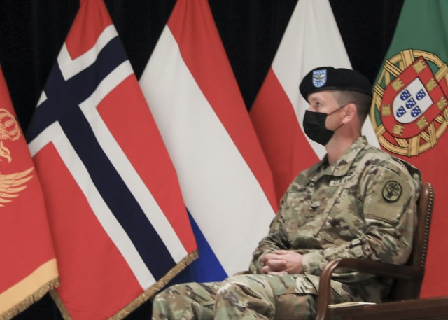 Mons, Belgium – U.S. Army Col. Michael D. Ronn listens to remarks by U.S. Air Force Gen. Tod D. Wolters, Supreme Allied Commander Europe (SACEUR), during a change of command ceremony where U.S. Army Col. Kathleen G. Spangler relinquished command of Supreme Headquarters Allied Powers Europe (SHAPE) Healthcare Facility and U.S. Army Health Clinic Brussels to Ronn, at SHAPE, Belgium, June 24.