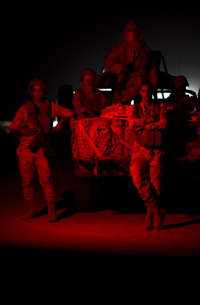 Mauritanian soldiers pose for a photo while they await instructions to begin a night-time simulated rescue operation exercise during FLINTLOCK 20 in Nouakchott, Mauritania, February 16, 2020. Flintlock is an annual, integrated military and law...