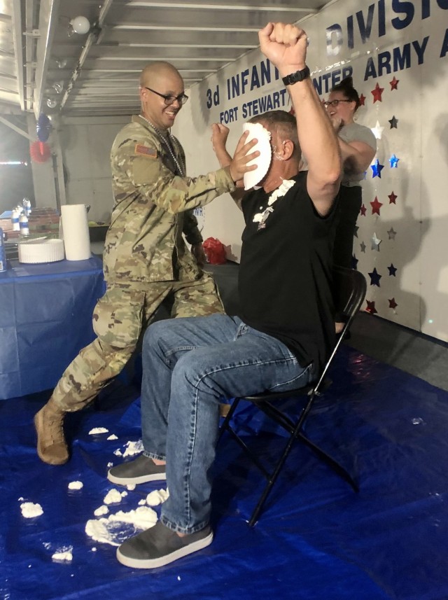 Sgt. Johnathan Rogrigues from the 3rd Infantry Division Rock Band smashes a pie in Maj. Gen. Charlie Costanza’s face during the Better Opportunities for Single Soldiers Pie in the Face fundraiser at the Fort Stewart Independence Day celebration, July 4 on Fort Stewart.