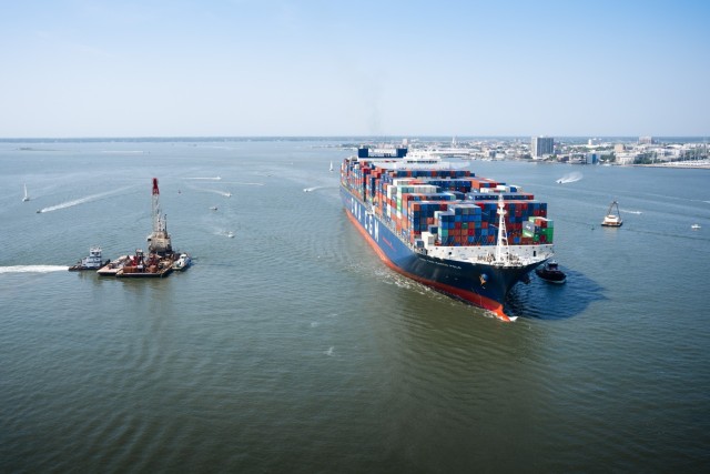 Large vessel moves across harbor
