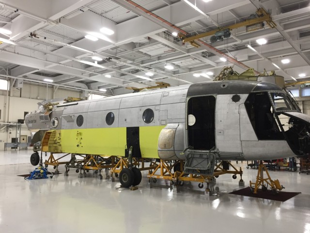 The shell of a CH-47 Chinook helicopter that was battle damaged from a hard landing while serving in Iraq sits in the maintenance bay of the Connecticut National Guard's 1109th Theater Aviation Support Maintenance Group in Groton, Conn. Sept. 3, 2019. The work being done on the aircraft was part of a new initiative from the unit to restore inoperable aircraft and get them back in the Army's operational fleet.