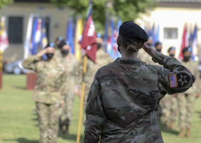 Vicenza, Italy – U.S. Army Lt. Col. Carla Schneider, commander, U.S. Army Health Clinic Vicenza, performs her first salute as the clinic’s commander during a change of command ceremony where U.S. Army Lt. Col. Joseph Matthews relinquished command of USAHC-V to Schneider at U.S. Army Garrison Italy, June 22.