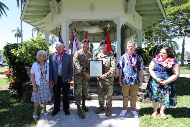 Lt. Gen. Spellmon presents Brig. Gen. Gibbs with his certificate of promotion.