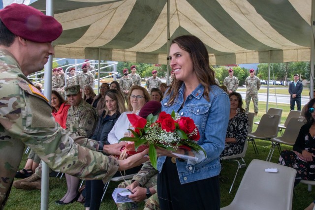 Tina Landers, the wife of Col. Chris Landers, outgoing commander of the 4th Infantry Brigade Combat Team (Airborne), 25th Infantry Division, US Army Alaska, receives a bouquet of red flowers during the brigade’s change-of-command ceremony July 08, 2021, at Joint Base Elmendorf-Richardson, Alaska. Col. Michael “Jody” Shouse assumed command of the 4th IBCT (A), 25th ID, from Col. Chris Landers during the change-of-command ceremony. (U.S. Army photo by Staff Sgt. Alexander Skripnichuk)