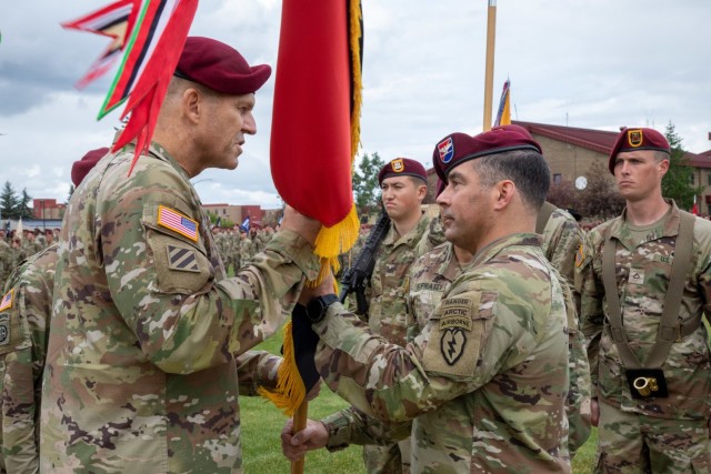 Col. Chris Landers, right, outgoing commander of the 4th Infantry Brigade Combat Team (Airborne), 25th Infantry Division, US Army Alaska, hands the brigade’s colors to Maj. Gen. Peter B. Andrysiak, Jr., middle, commander of US Army Alaska, to symbolize the successful completion of command during a change-of-command ceremony July 08, 2021, at Joint Base Elmendorf-Richardson, Alaska. Col. Michael “Jody” Shouse assumed command of the 4th IBCT (A), 25th ID, from Landers during the change-of-command ceremony. (U.S. Army photo by Staff Sgt. Alexander Skripnichuk)