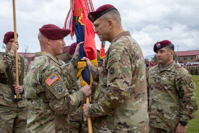 Maj. Gen. Peter B. Andrysiak, Jr., right, commander of US Army Alaska, hands the colors belonging to the 4th Infantry Brigade Combat Team (Airborne), 25th Infantry Division, US Army Alaska, to Col. Michael “Jody” Shouse, the new commander of the 4th IBCT (A), 25th ID, during a change-of-command ceremony July 08, 2021, at Joint Base Elmendorf-Richardson Alaska. Shouse assumed command of the 4th IBCT (A), 25th ID, from Col. Chris Landers during the change-of-command ceremony. (U.S. Army photo by Staff Sgt. Alexander Skripnichuk)