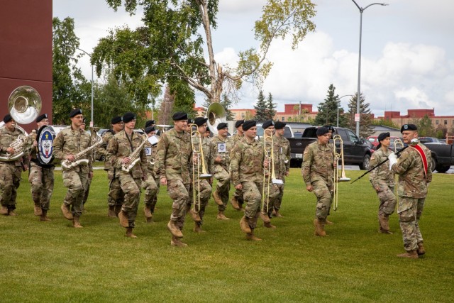 Soldiers with the 9th Army Band march onto Pershing field at Joint Base Elmendorf-Richardson, Alaska, during the 4th Infantry Brigade Combat Team (Airborne), 25th Infantry Division’s change-of-command ceremony July 08, 2021. Col. Michael “Jody” Shouse assumed command of the 4th IBCT (A), 25th ID, from Col. Chris Landers during the change-of-command ceremony. (U.S. Army photo by Staff Sgt. Alexander Skripnichuk)