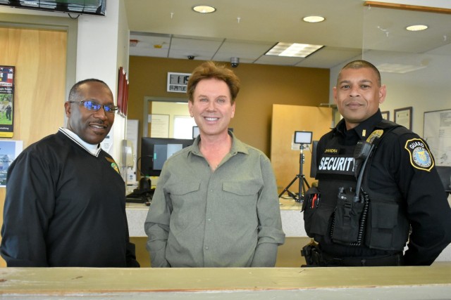 From left, Nathaniel Pleasantbey, Survivor Outreach Services program coordinator, De Amaral, and Lt. Neel Chandra, pose for a photo after De Amaral received his badge at the Visitors Center, PoM, Calif., June 29. Pleasantbey and Chandra were...