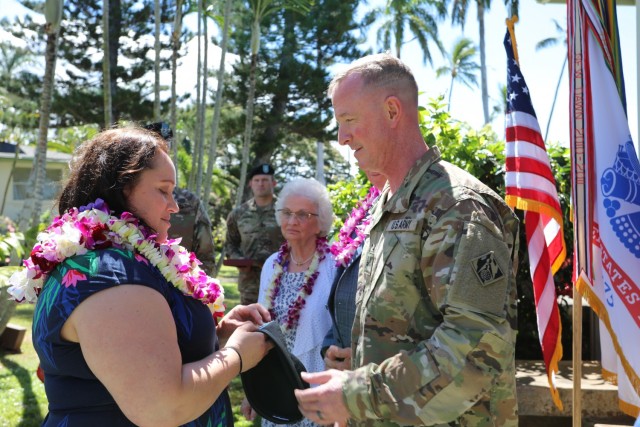 Kim Gibbs pins the brigadier general rank on her husband's headgear, newly promoted Brig. Gen. Kirk Gibbs. Col. Kirk Gibbs, commander of the U.S. Army Corps of Engineers Pacific Ocean Division, was promoted to brigadier general during a...