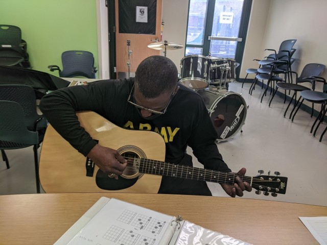 In late January 2021, Sgt. Maj. Gerald Cureton, a Soldier from the Fort Bliss Soldier Recovery Unit, Texas, participated in guitar lessons offered by the SRU’s adaptive reconditioning program. (Photo courtesy of Alan Cooksey)