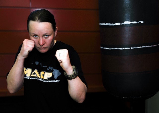 U.S. Army Sgt. Sarah Schneider Chance, a nutrition care specialist at Landstuhl Regional Medical Center, conducts training at Landstuhl Fitness Center, Germany. Prior to enlisting in the U.S. Army, Schneider Chance was a professional Mixed Martial Arts fighter and credits the discipline and teamwork learned from professional fighting for her decision to enlist. 
