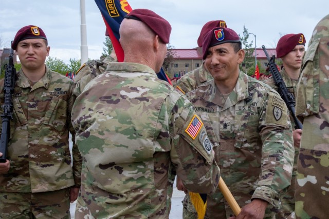 Col. Michael “Jody” Shouse, left, incoming commander of the 4th Infantry Brigade Combat Team (Airborne), 25th Infantry Division, US Army Alaska, hands the brigade colors to Command  Sgt. Maj. Alex Kupratty, the command sergeant major of the 4th IBCT (A), 25th ID, during a change-of-command ceremony July 08, 2021, at Joint Base Elmendorf-Richardson, Alaska. Col. Michael “Jody” Shouse assumed command of the 4th IBCT (A), 25th ID, from Col. Chris Landers during the change-of-command ceremony. (U.S. Army photo by Staff Sgt. Alexander Skripnichuk)