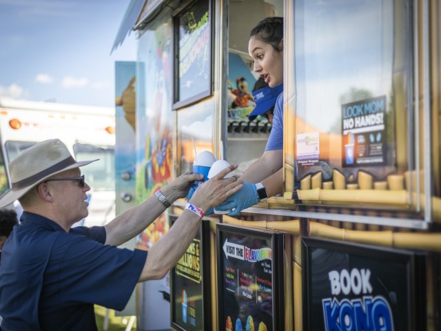 Chaplain (Col.) Allen Staley, the Fort Bliss senior chaplain, cools down with some snow balls at Pop Goes the Fort, the on-post Independence Day celebration, at Fort Bliss, Texas, July 4, 2021.