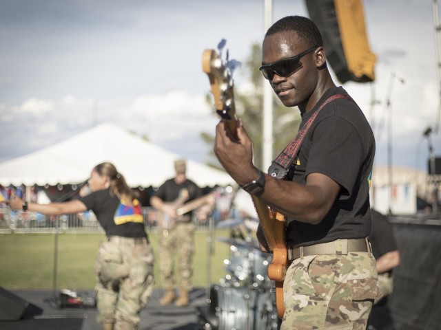 Spc. Aloysious Butler, a Soldier and musician from the 1st Armored Division Band, performs at Pop Goes the Fort, the on-post Independence Day celebration, at Fort Bliss, Texas, July 4, 2021. Butler plays with Iron Will, the 1st AD Band’s rock band.