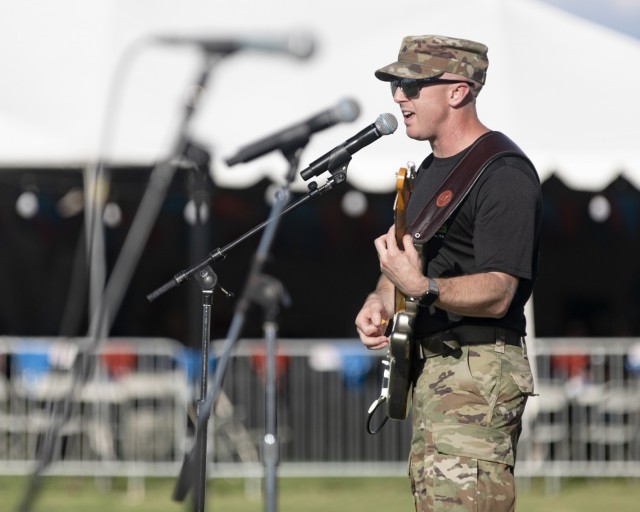 Sgt. Philip Green, a Soldier and musician from the 1st Armored Division Band, performs at Pop Goes the Fort, the on-post Independence Day celebration, at Fort Bliss, Texas, July 4, 2021. Green plays with Iron Will, the 1st AD Band’s rock band.