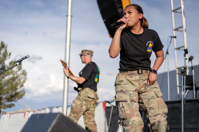 Spc. Pierre-Marie Colton joins Iron Will, the 1st Armored Division Band’s rock band, for a performance at Pop Goes the Fort at Fort Bliss, Texas, July 4, 2021. Hosted by Fort Bliss FMWR, Pop Goes the Fort is the installation’s annual Independence Day celebration.