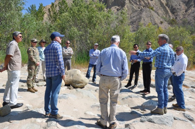 Leaders from the U.S. Army Corps of Engineers Los Angeles District team meet with the Ventura County Watershed District team, July 1, 2021, in the bed of Santa Paula River for an overview of upcoming projects.