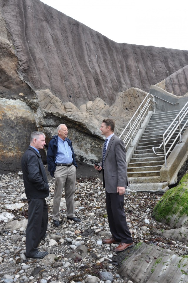 Pismo Beach Mayor Ed Waage, center, discusses the completed project with U.S. Army Corps of Engineers Los Angeles Deputy District Engineer David Van Dorpe, right, and Supervisory Civil Engineer Steve Dwyer, at the foot of a new public beach...