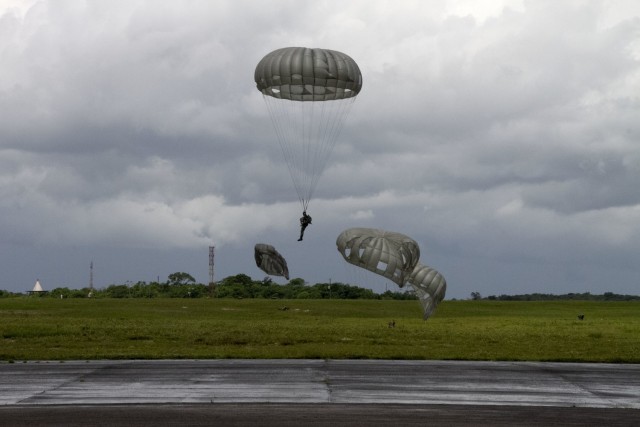 A Soldier participating in a Tradewinds 21 combined forces jump prepares to land at Airbase London, Guyana, June 20, 2021. Tradewinds 21 is a U.S. Southern Command-sponsored Caribbean security exercise with partner nations in the ground, air, sea and cyber domains.