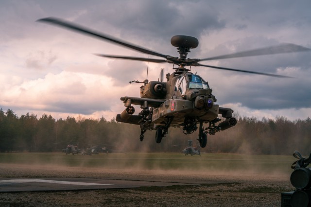 An AH-64 Apache of the 12th Combat Aviation Brigade, Wings of Victory, launches from the forward area rearming and refueling point to begin single-ship aerial gunnery tables during the 1st Battalion, 3rd Aviation Regiment's preparation for...