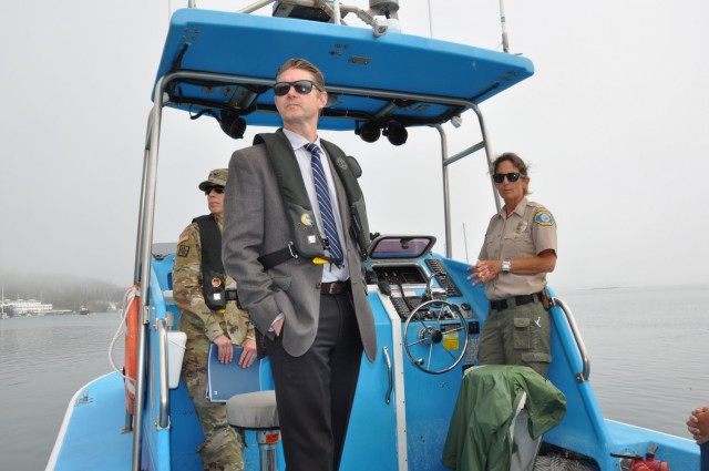 Commander. Col. Julie Balten, U.S. Army Corps of Engineers Los Angeles District and Deputty District Engineer David Van Dorpe observe features of Morro Bay aboard a patrol boat piloted by Morro Harbor Patrol Supervisor Becka Kelly. during a tour...