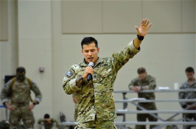 CH (CPT) Caleb Lau, Chaplain, 3rd Battalion, 75th Ranger Regiment, offers a word of encouragement and prayer for the Rangers of 3rd Battalion, before a nighttime Airborne jump and Battalion-level exercise.