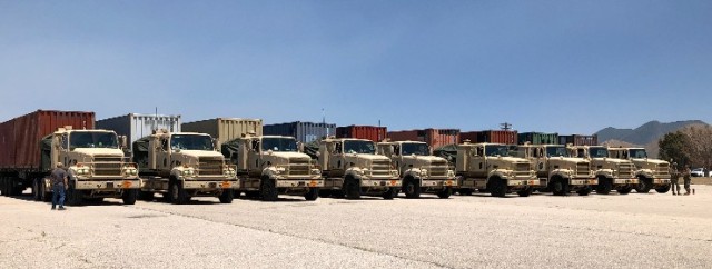 Row of army trucks.