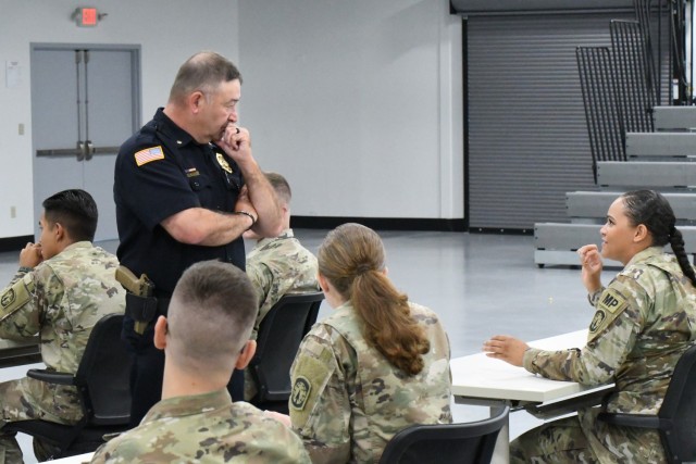 Fort Drum Police Chief Todd Julian speaks with the Mountain Guardian Academy class during their graduation ceremony July 6. The academy is a blend of classroom lectures and hands-on practical exercises that tests Soldiers in a variety of law...