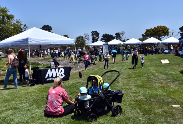 Members of the Presidio of Monterey and Navy Postgraduate School communities enjoy the “Party in the Park” at La Mesa Village, Monterey, Calif., July 9.